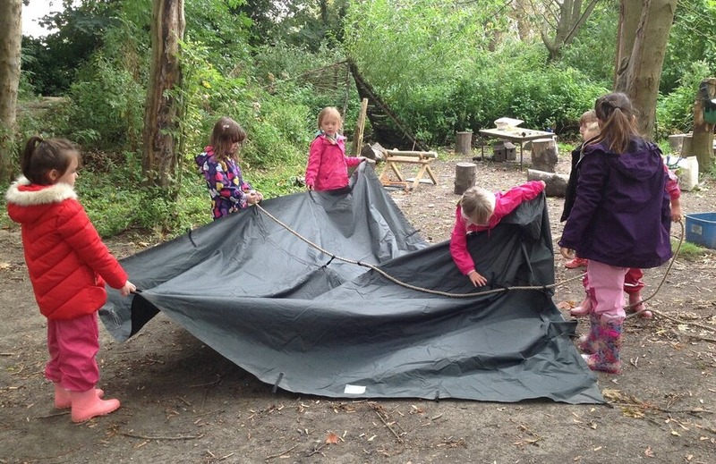 Children working together to make a shelter